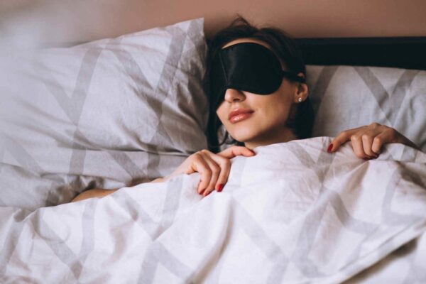 woman-peacefully-sleeping-with-eye-mask-on-1024x683